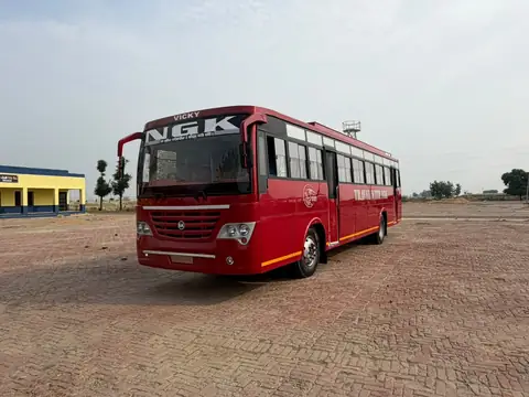 Ordinary bus, maroon livery, front three-quarter view — built by Guru Kirpa Bus Body Builders, Barnala